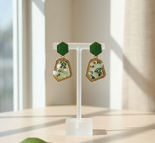 Decorative earrings on a stand with a neutral background
